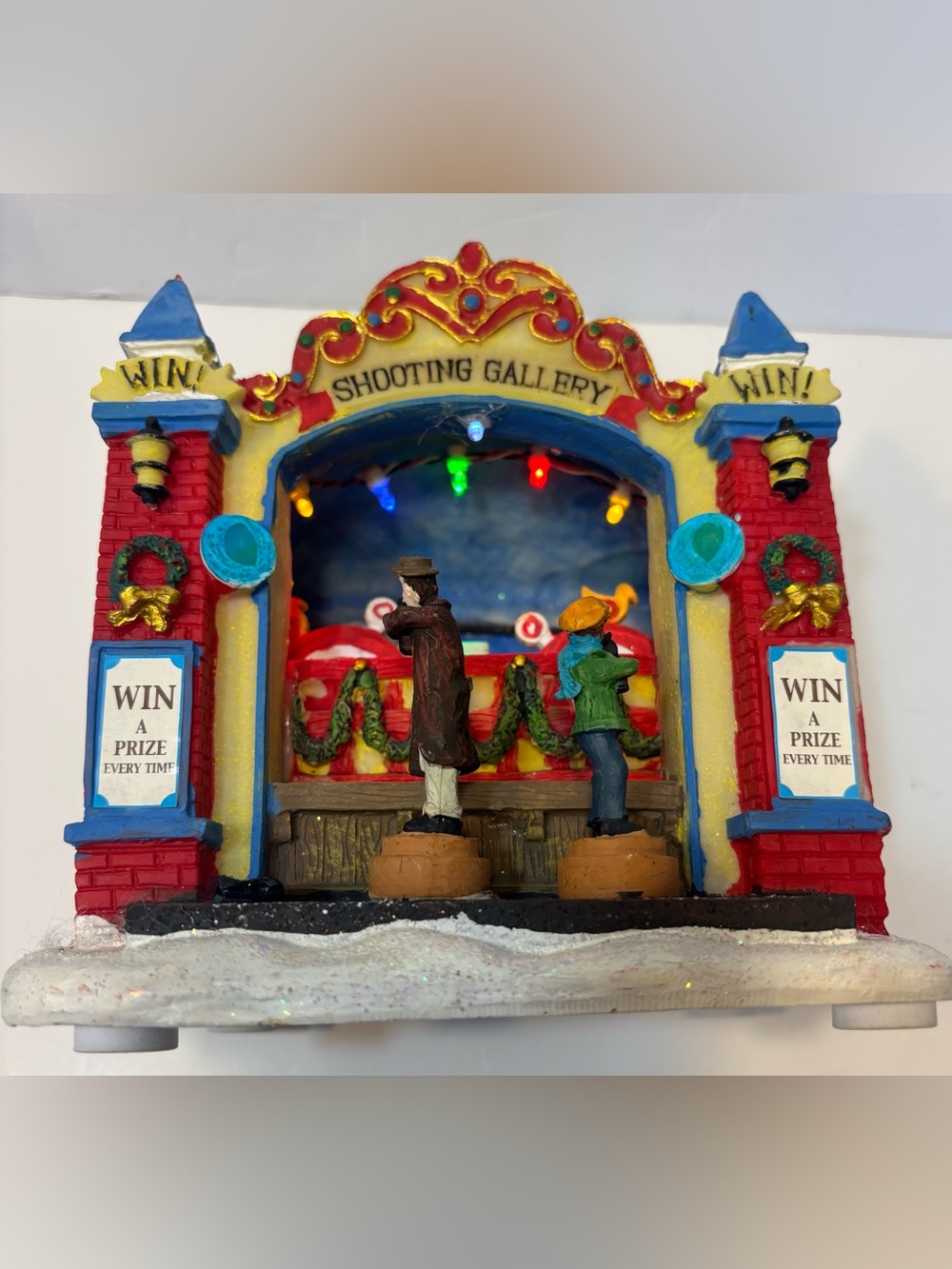 Shooting Gallery Holiday Figurine - Multicolor Rotates and lights up, see video